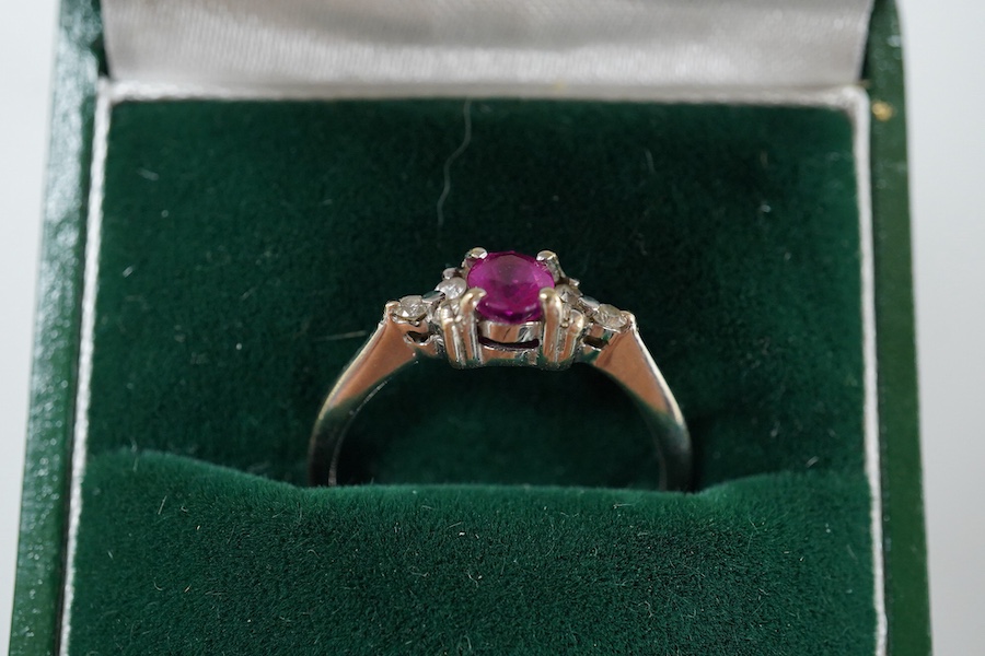 A cased late Victorian 9ct and single stone amethyst set bar brooch, 45mm, a cased yellow metal and single stone white opal set stick pin and a modern 18ct white gold, ruby and diamond cluster ring, size L/M.